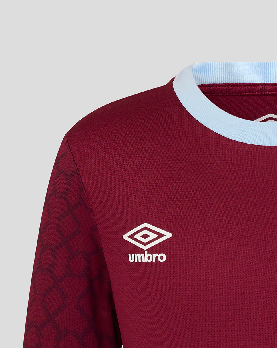 Shoulder close-up of West Ham Junior Home shirt with light blue collar and patterned sleeve and Umbro logo