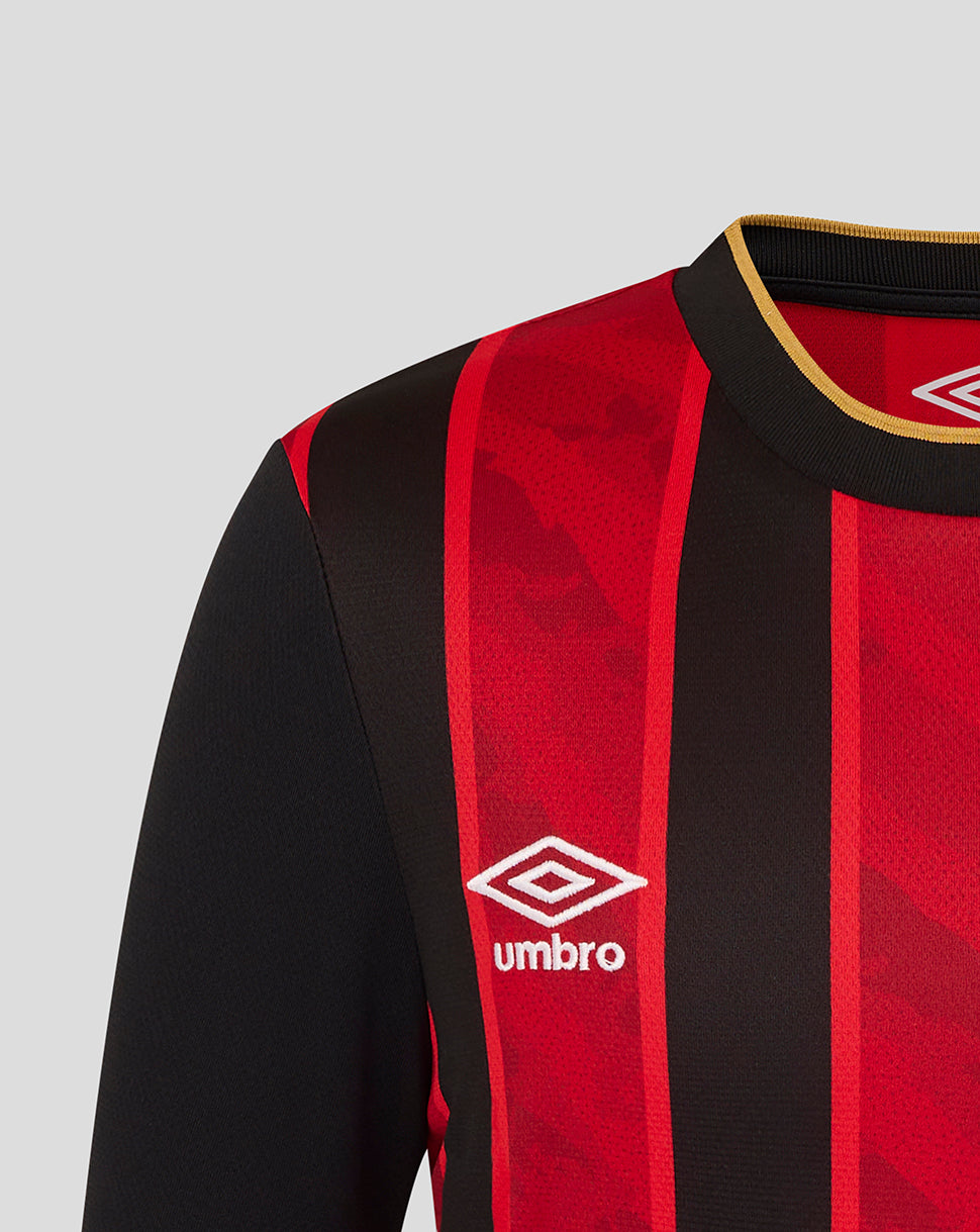 Close up of collar and shoulder on the red and black striped jersey with gold trim and the Umbro logo.