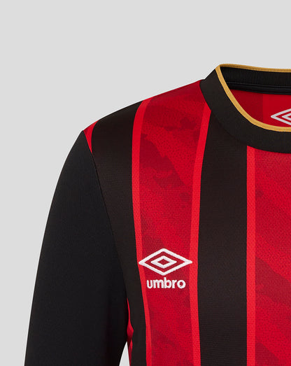 Close up of collar and shoulder on the red and black striped jersey with gold trim and the Umbro logo.