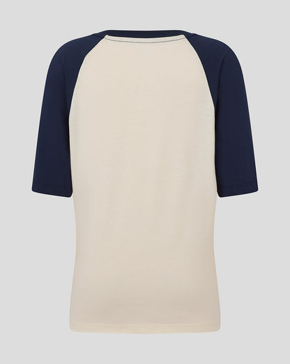 Back view of beige raglan tee with navy sleeves