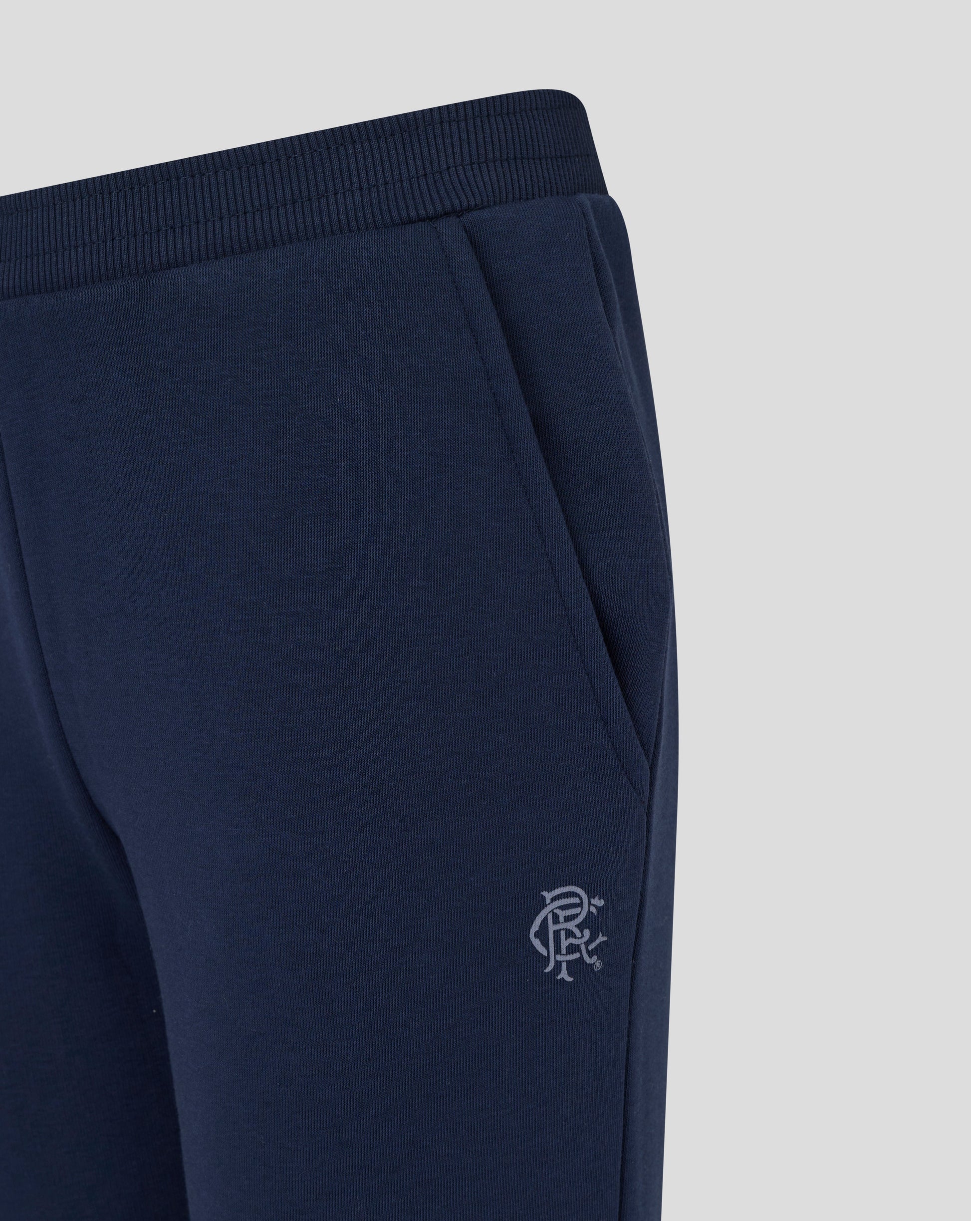 Close up of navy Rangers joggers fabric with side pocket and crest on the thigh
