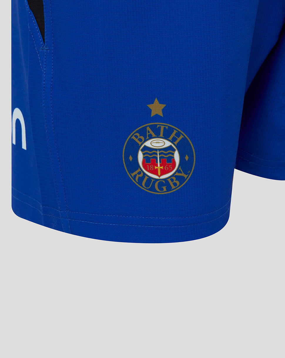 Close up of Bath Rugby junior shorts showing Bath crest on the left leg and Castore logo on the right leg