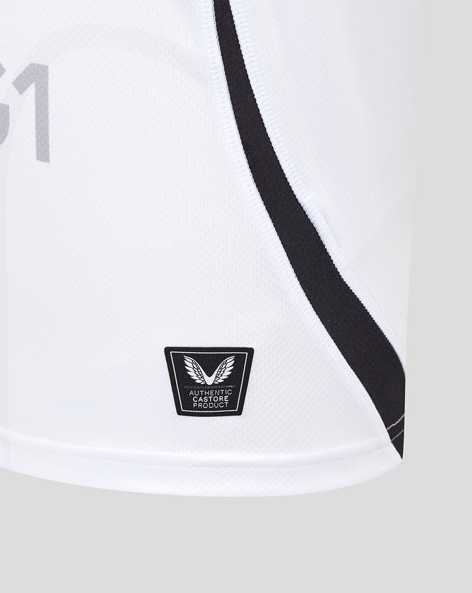 Close-up of white Bath Rugby away shirt fabric with a bold black seam stripe and a Castore Authentic Product badge at the hem