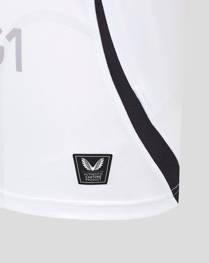 Close-up of white Bath Rugby away shirt fabric with a bold black seam stripe and a Castore Authentic Product badge at the hem