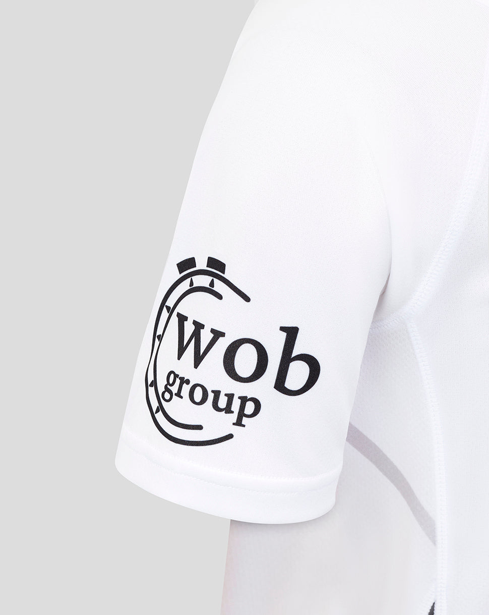 Sleeve of white Bath Rugby away shirt displaying the Wob group sponsor logo near the cuff