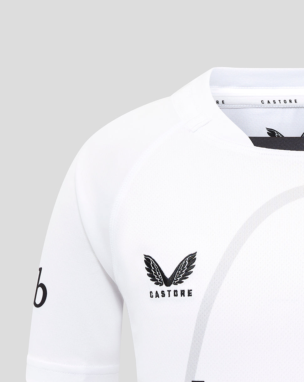 Detail of white Bath Rugby jersey showing Castore branding at the collar with a partial club badge
