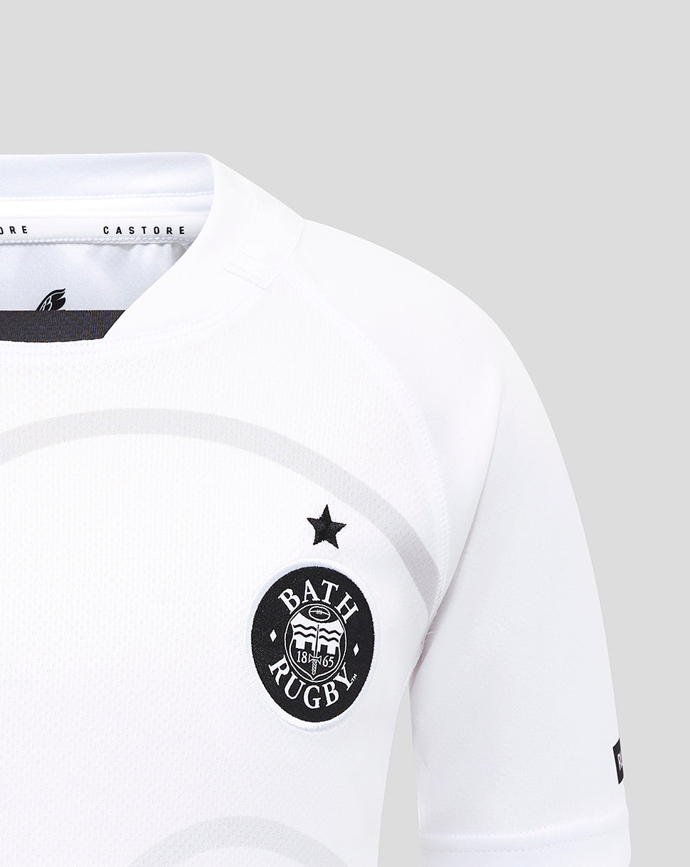 Close up of Bath Rugby crest and star on white junior away replica shirt