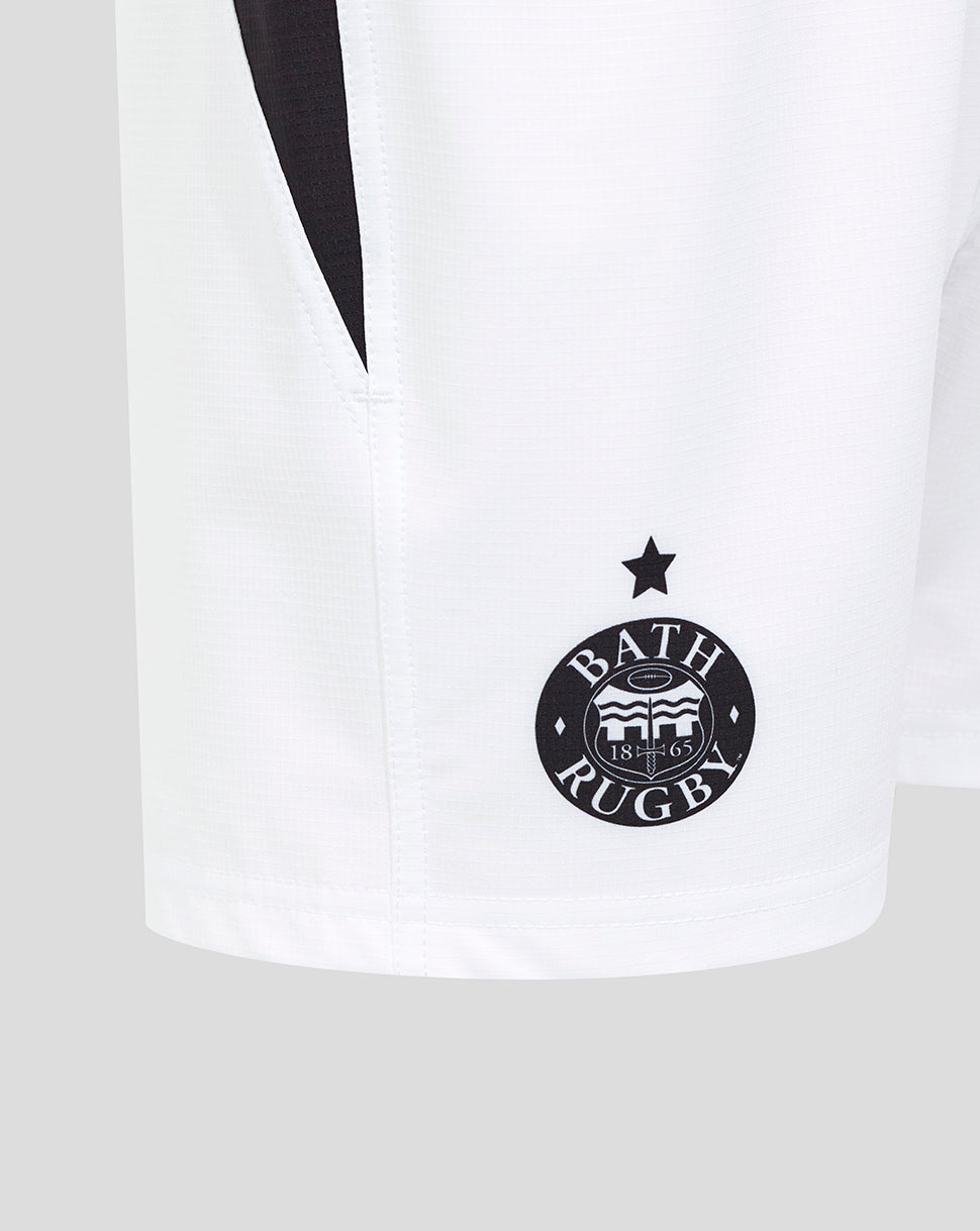 Close-up of white Bath Rugby shorts showing the Bath Rugby crest on the left leg