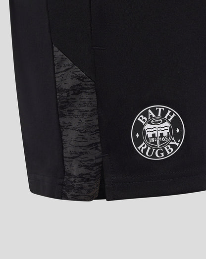 Close-up of the lower leg showing a camo panel and Bath Rugby badge on black shorts.