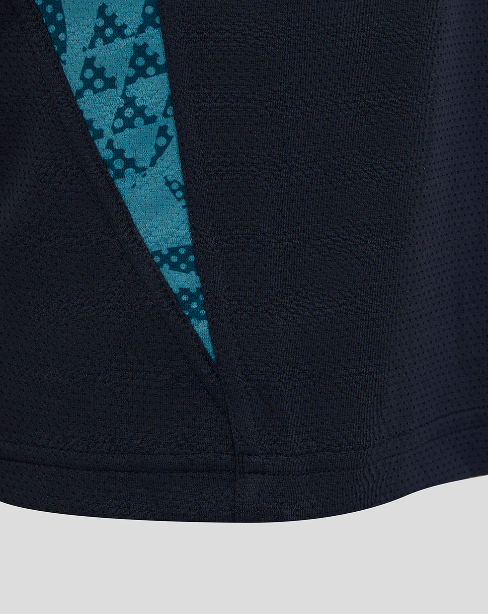 Close-up of navy junior England rugby performance T-shirt showing a teal abstract side panel detail