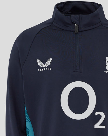 Close-up front of navy midlayer with Castore logo on left chest rose crest on right chest and turquoise side panel.