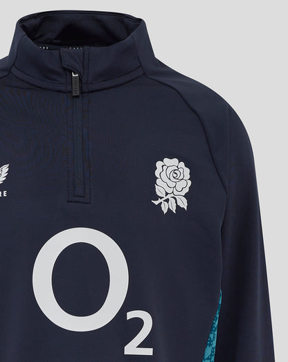Front view of navy Junior England performance midlayer top with large O2 logo center, rose crest and Castore branding.