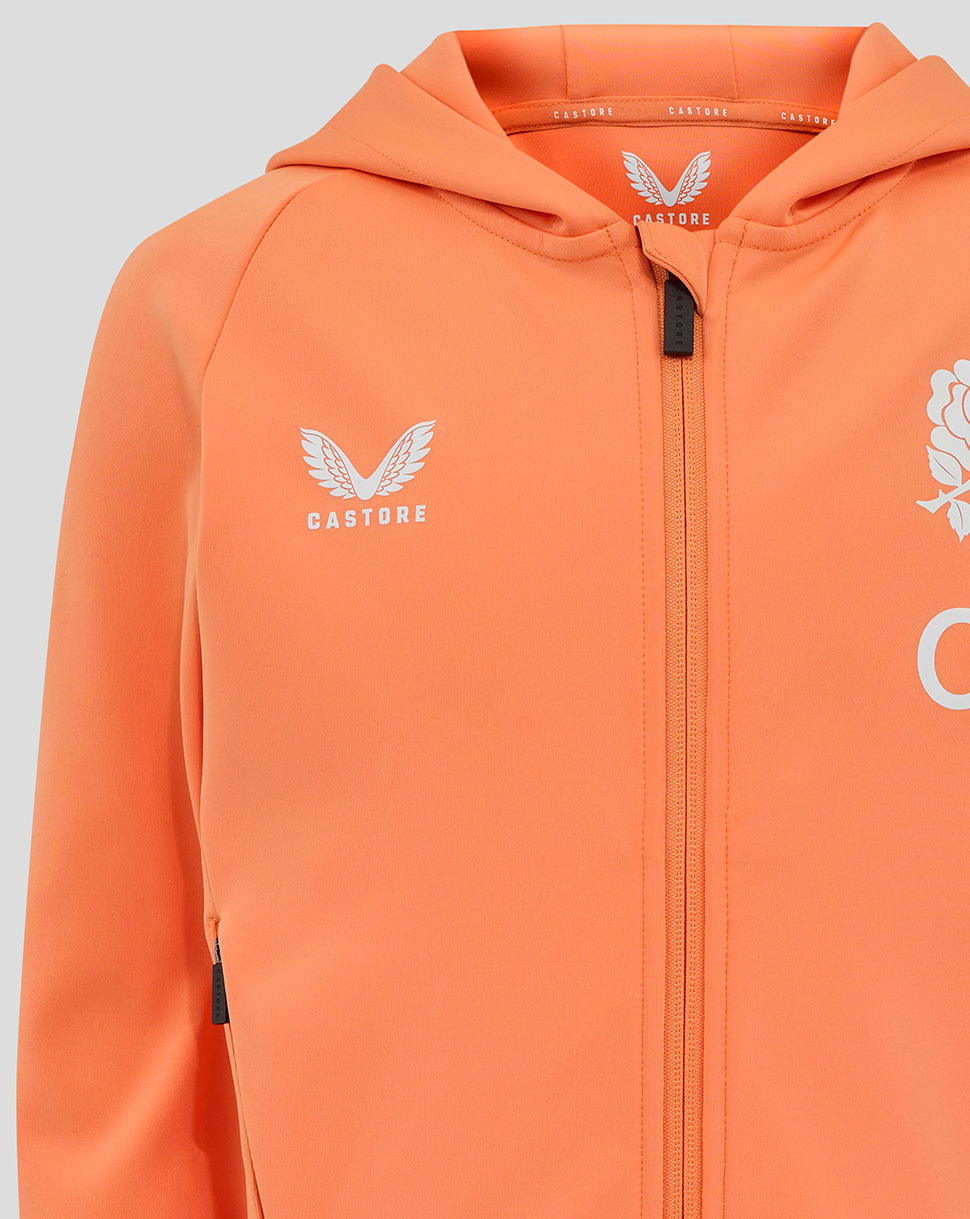 Close up of orange hoodie chest area with Castore logo on left, rose motif on right, and center zipper
