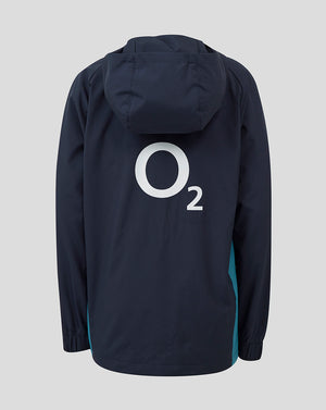 Back view of navy junior England rugby shower jacket with large O2 logo on the back and teal side panels