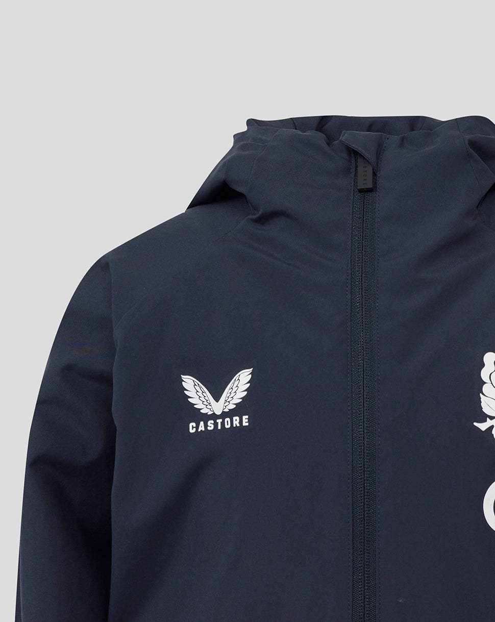 Navy jacket chest close-up featuring Castore emblem with wings and front zipper.