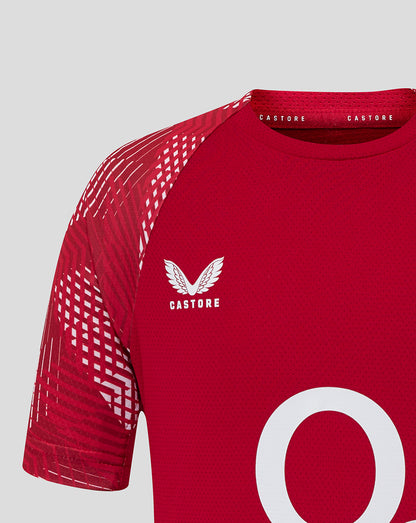 Close-up of upper torso of junior England Rugby pre match shirt in red featuring the rose crest and Castore branding