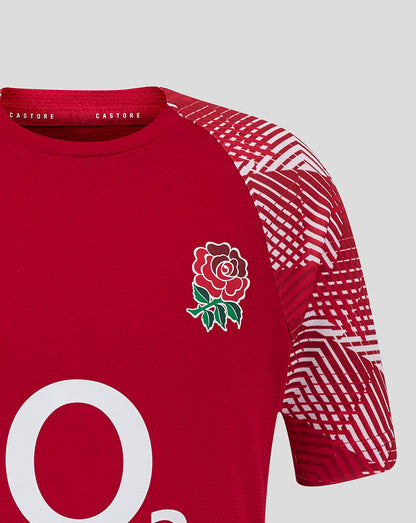 Close-up of junior England Rugby pre match short sleeve shirt in red with a rose crest on the left chest and bold sleeve print