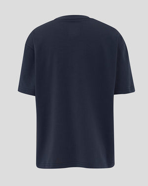 Front view of navy travel T shirt with rose crest and Castore branding on the chest.