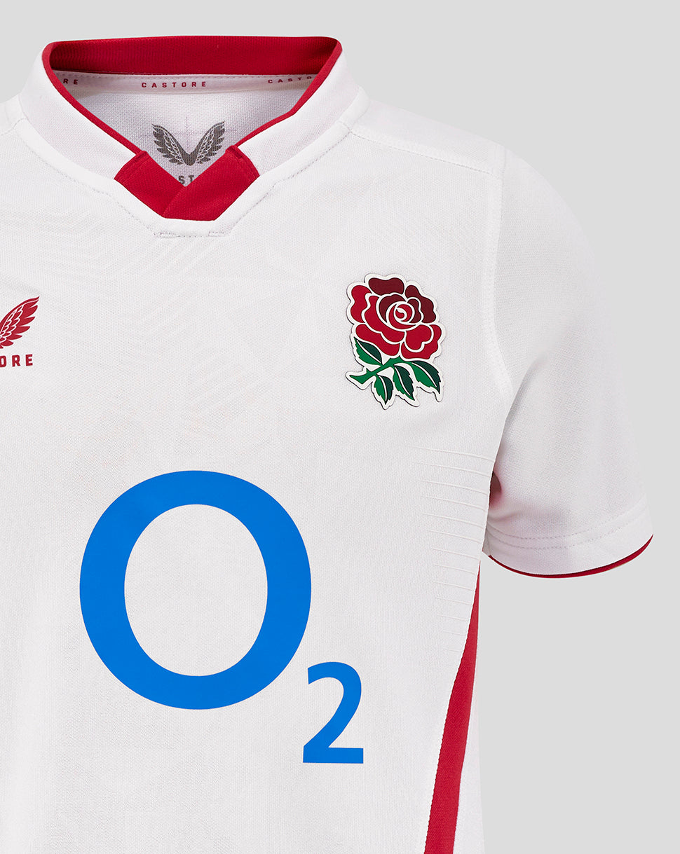 Close-up of the white Junior England Rugby Home Pro Shirt front showing the rose crest and O2 logo on the chest
