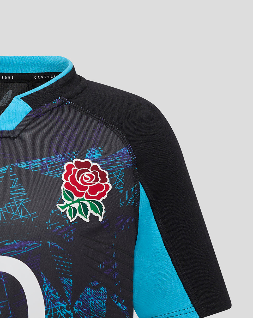 Close-up of the shoulder area showing the England rose crest on a black Pro Shirt with turquoise sleeve trim.