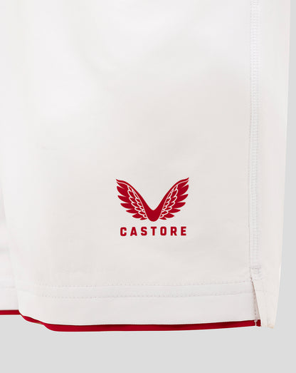 White junior England rugby shorts close up with Castore crest on the leg.