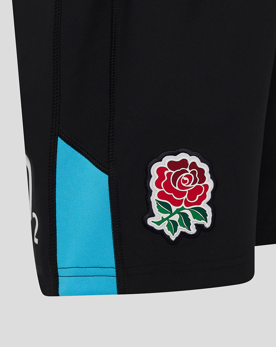 Close up of black England rugby junior shorts with turquoise side panel and a stitched rose crest near the hem
