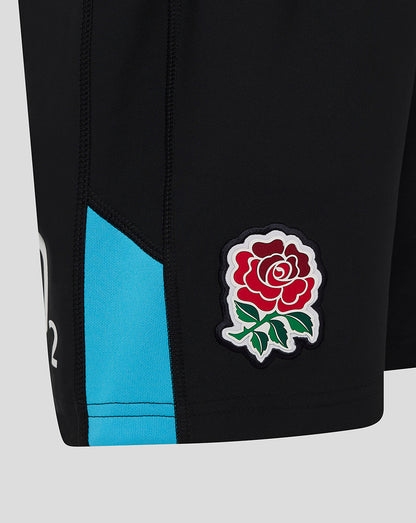 Close up of black England rugby junior shorts with turquoise side panel and a stitched rose crest near the hem