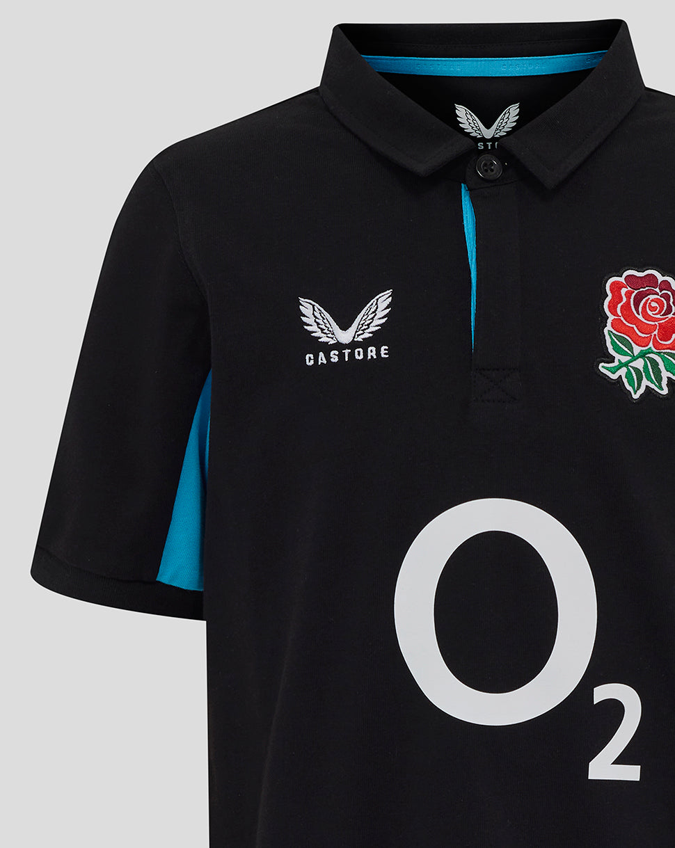 Detail front view of black England Rugby junior polo with blue placket piping and rose crest.
