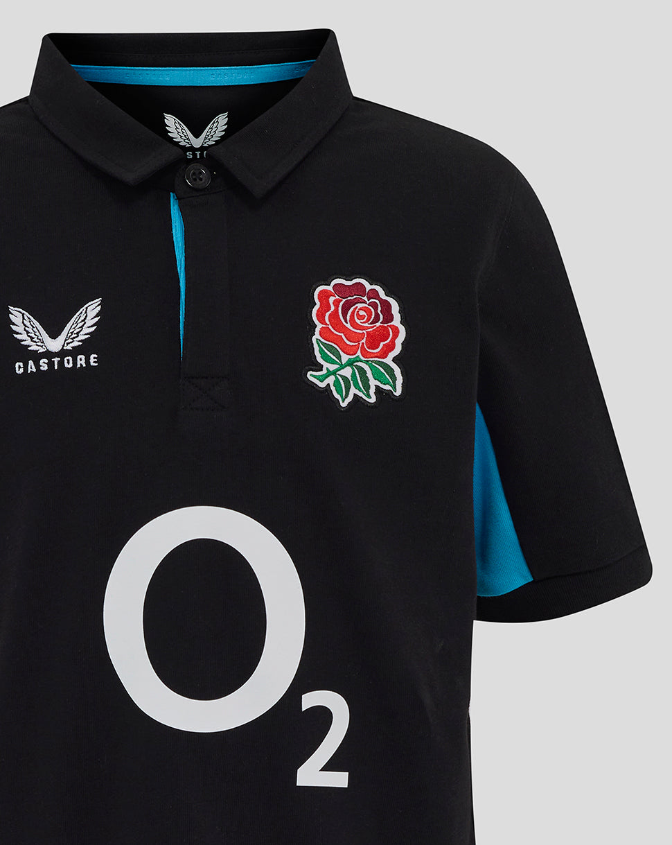 Front close-up of black England Rugby polo showing Castore emblem, rose crest and large O2 sponsor.