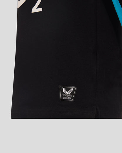 Close up of black junior England Rugby long sleeve shirt hem with Castore authenticity patch