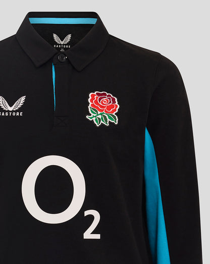 Front view of black rugby shirt with turquoise collar trim, Castore logo on the left chest, rose badge on the right, and a large O2 graphic.