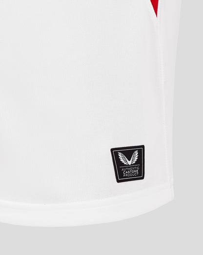 Close-up of the lower back hem with an authentic Castore product badge.