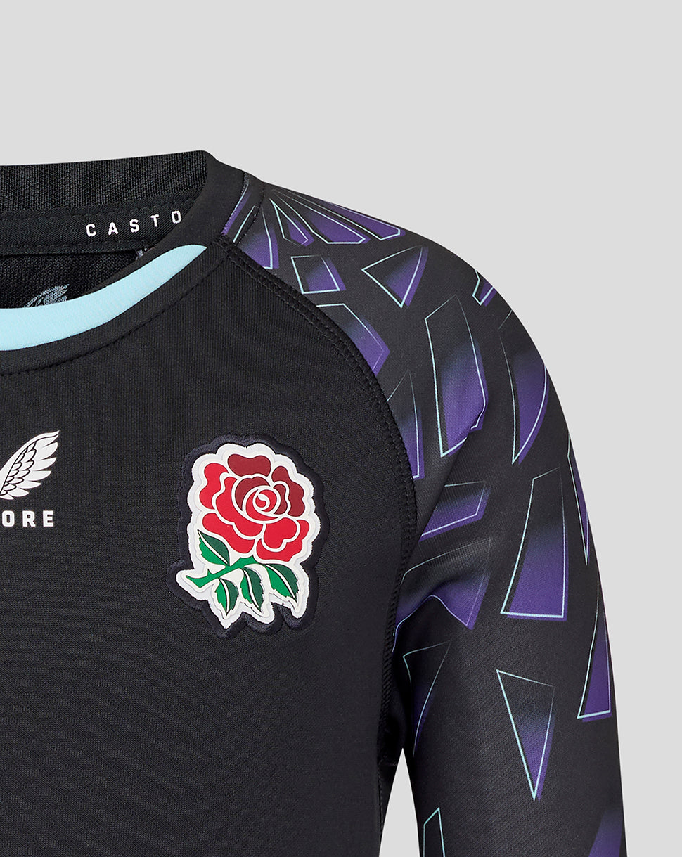 Chest area with red rose badge and wing logo on black fabric with purple angular sleeve design.