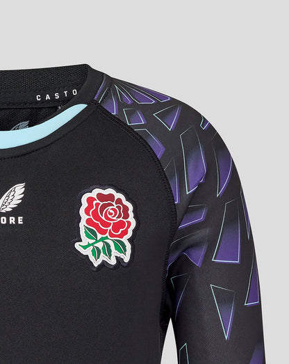 Chest area with red rose badge and wing logo on black fabric with purple angular sleeve design.