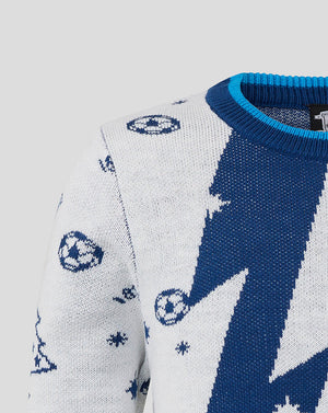 Shoulder close up of Preston North End junior Christmas jumper showing white sleeve with soccer ball motifs against blue knit