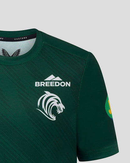 Shoulder and chest close up of dark green Leicester Tigers junior warm up T shirt displaying Breedon branding and tiger head