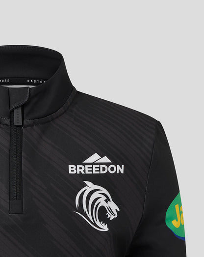 Upper torso view highlighting tiger crest and Jeep sleeve patch on black Leicester Tigers Junior training quarter zip