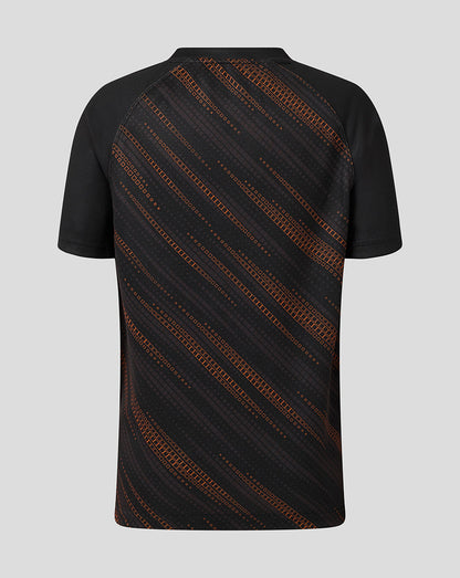 Back view of Leicester Tigers Junior 25/26 Warm Up Jersey in black with orange diagonal stripes