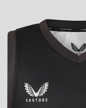 Close up of the vest neckline showing brown trim and Castore branding inside