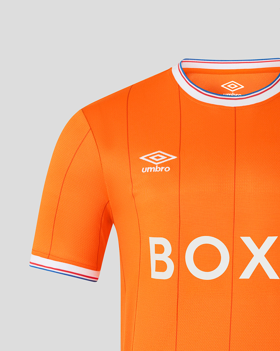 Front view of bright orange Rangers infant shirt withUmbro logo on the chest and BOX sponsor across the front and a striped collar