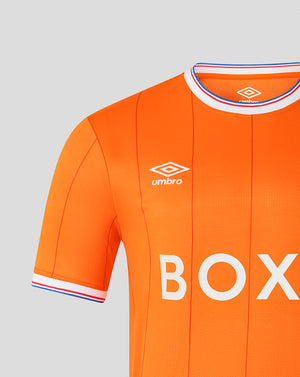 Close-up of collar and shoulder on orange Rangers jersey with Umbro logo and striped trim