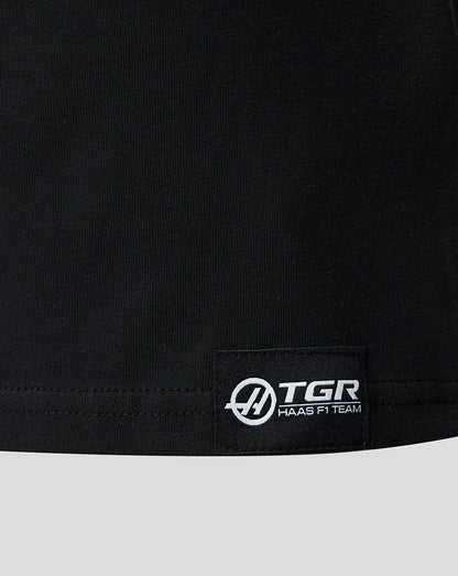 Woven label at the lower front hem of the black Haas F1 Team T shirt