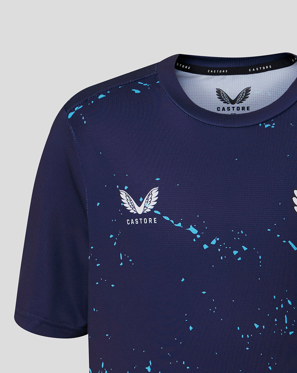 Navy blue athletic shirt with white logo and splatter design on a light gray background