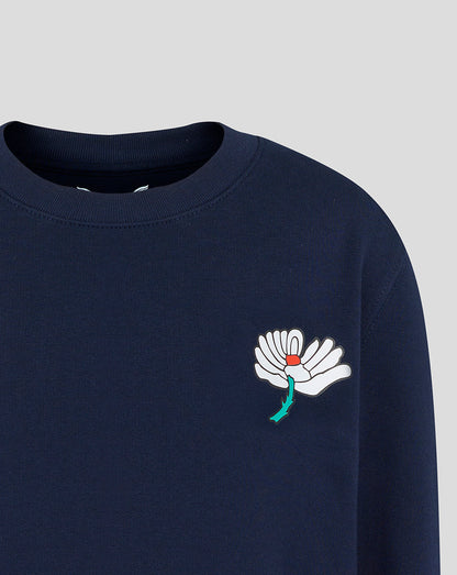 Navy blue sweatshirt with a white flower design on a light gray background