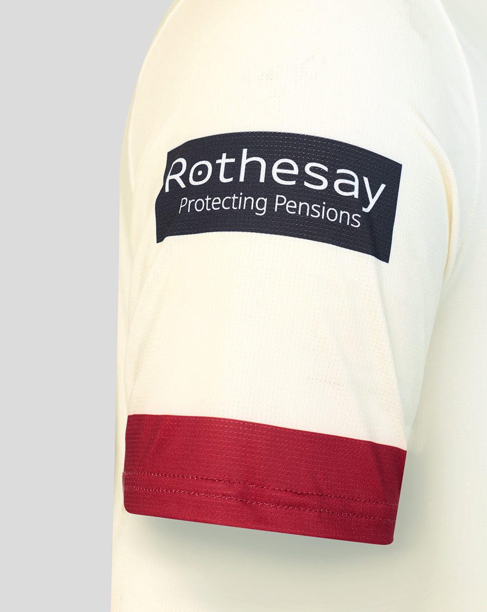 Cream Lancashire junior County Champs jersey sleeve with Rothesay sponsor patch and maroon cuff.