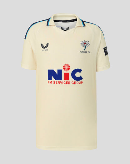 Beige sports jersey with logos on a gray background
