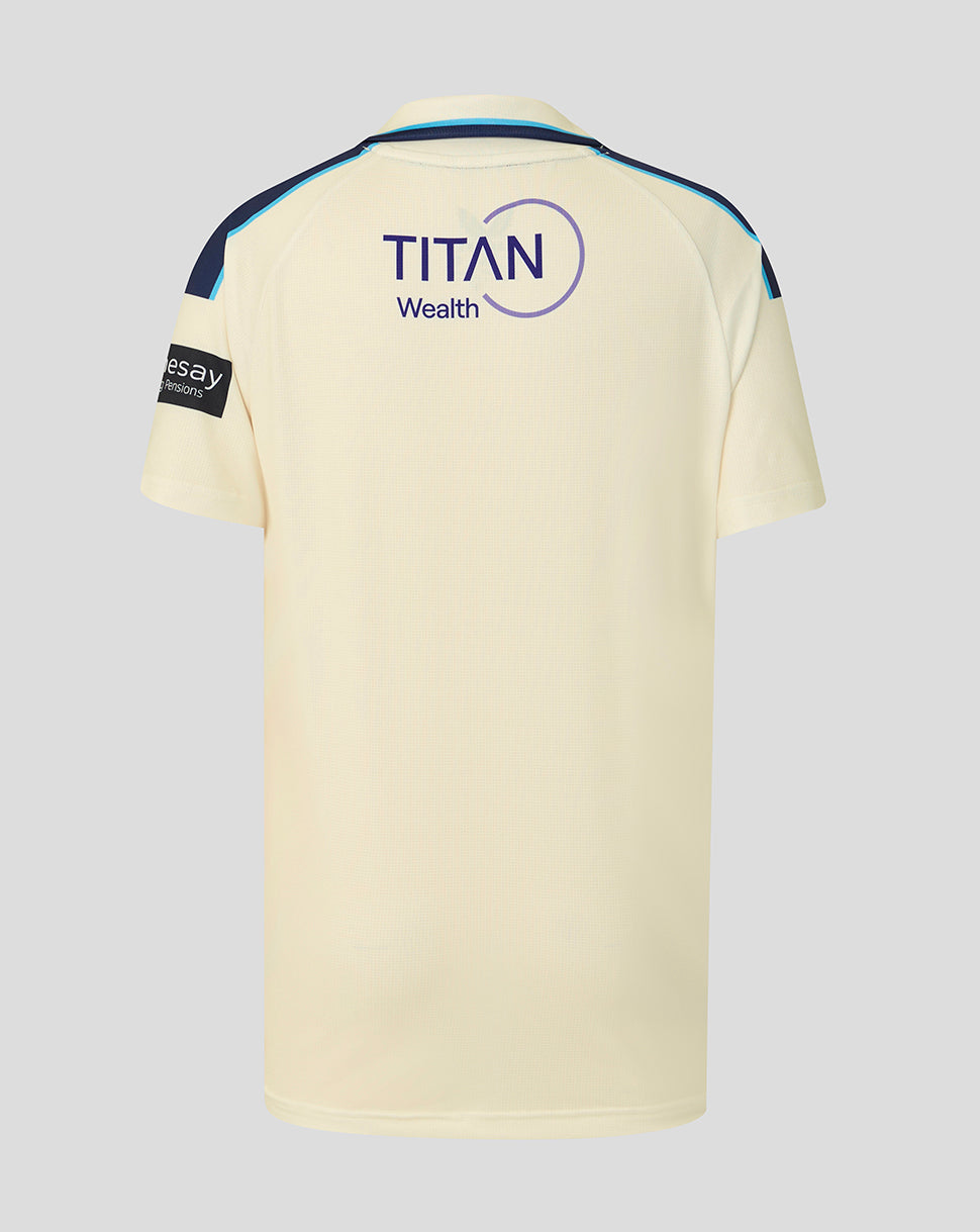 Beige sports jersey with 'Titan Wealth' logo on a gray background