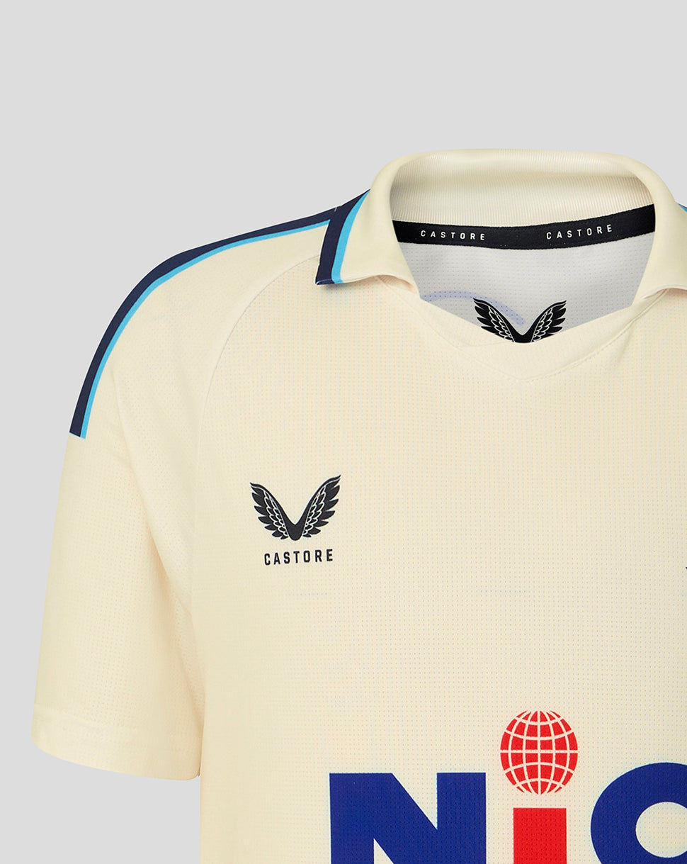 Beige sports jersey with Castore logo on a light gray background