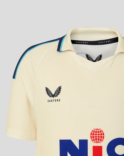 Beige sports jersey with Castore logo on a light gray background