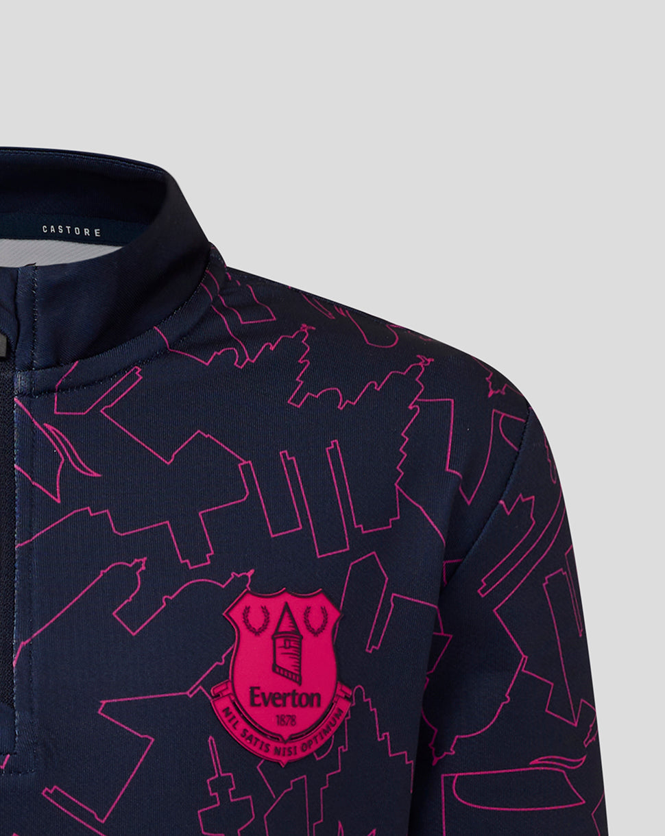 Navy shirt with pink geometric pattern and Everton logo on a light gray background